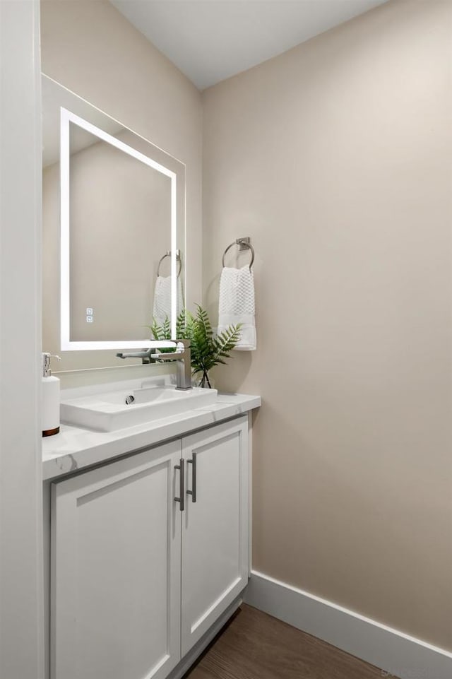 bathroom featuring vanity and wood-type flooring