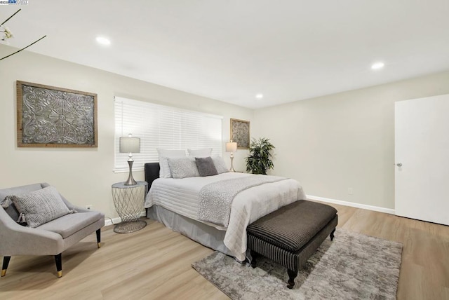 bedroom with light hardwood / wood-style floors