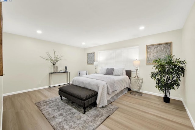 bedroom with light hardwood / wood-style flooring