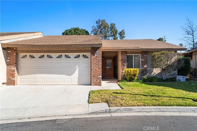 ranch-style house with a garage and a front yard