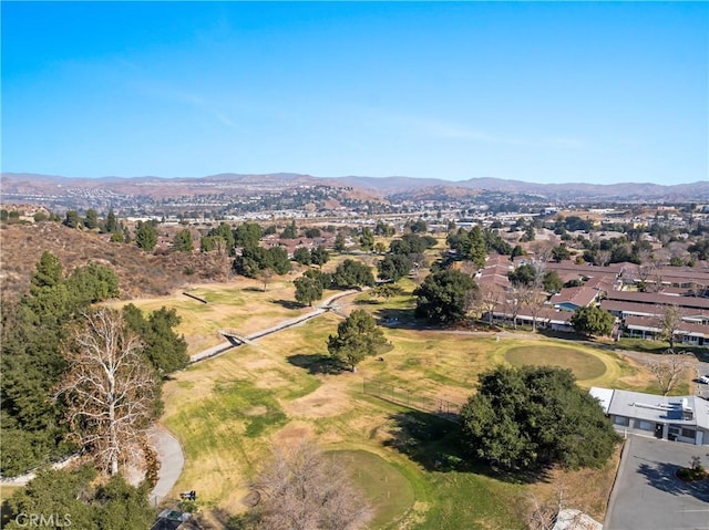 birds eye view of property featuring a mountain view