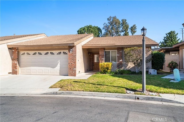 ranch-style home with a garage and a front lawn