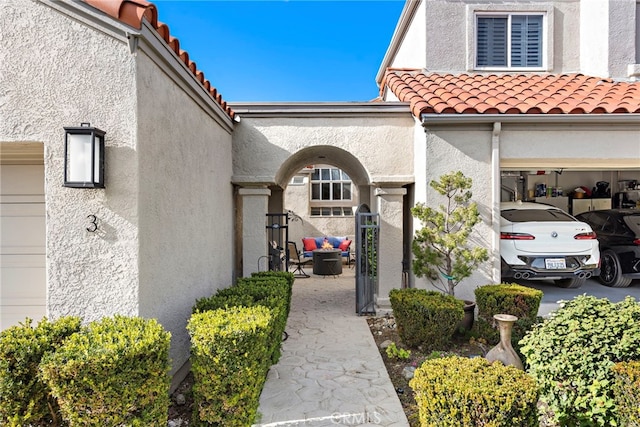 doorway to property with a garage