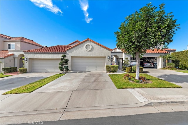 mediterranean / spanish-style home featuring a garage