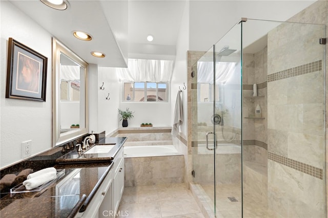 bathroom with vanity and plus walk in shower