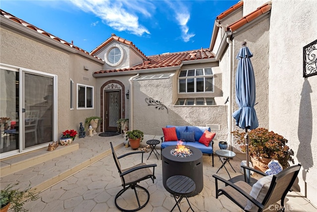 view of patio featuring a fire pit