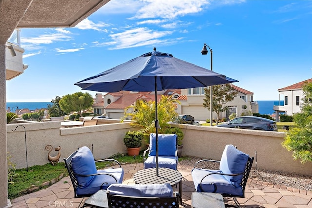 view of patio / terrace featuring a water view