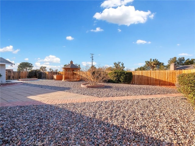 view of yard with a gazebo and a patio area