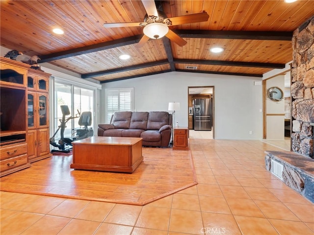 tiled living room featuring lofted ceiling with beams, wooden ceiling, and ceiling fan