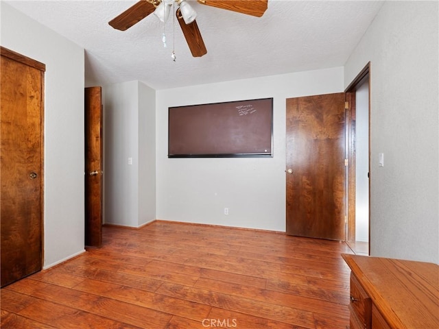 spare room with ceiling fan and light hardwood / wood-style flooring