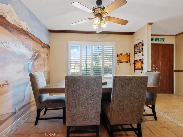 dining space featuring ceiling fan, ornamental molding, and light tile patterned floors