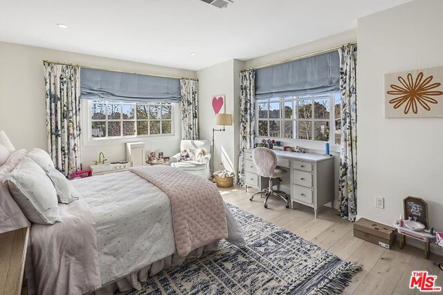 bedroom with light wood-type flooring