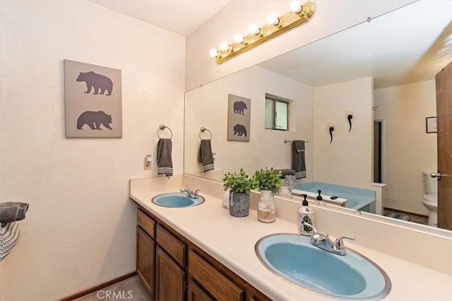 bathroom with vanity and toilet