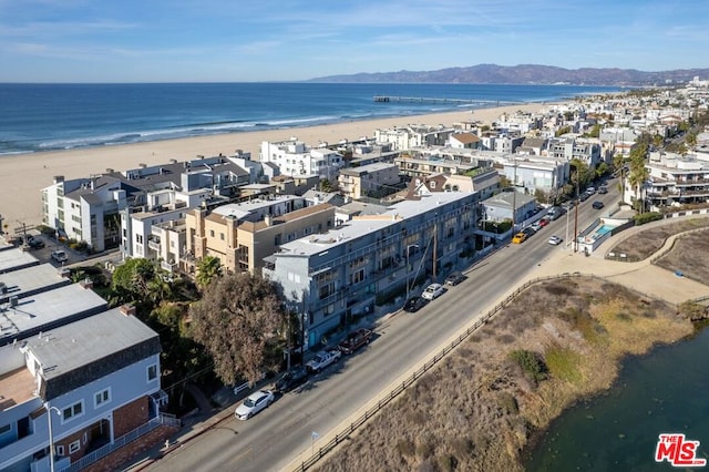 bird's eye view with a water and mountain view and a beach view