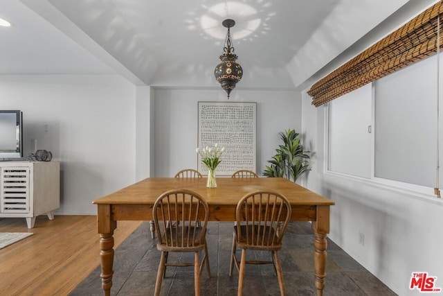 dining space with dark hardwood / wood-style floors