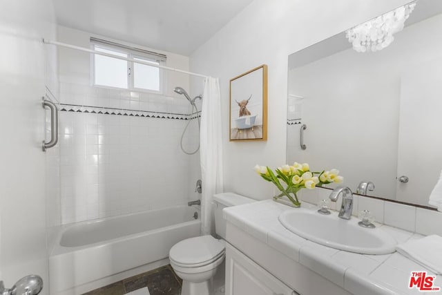 full bathroom featuring shower / tub combo with curtain, vanity, and toilet