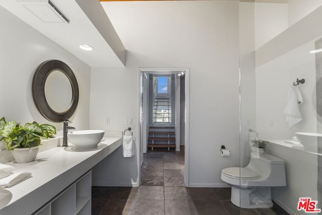 bathroom featuring vanity and toilet