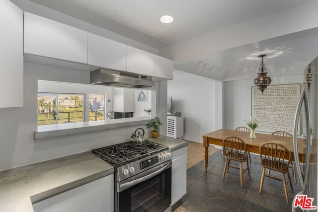 kitchen featuring appliances with stainless steel finishes and white cabinets