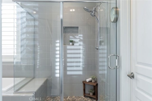 bathroom featuring an enclosed shower