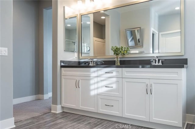 bathroom featuring hardwood / wood-style flooring and vanity