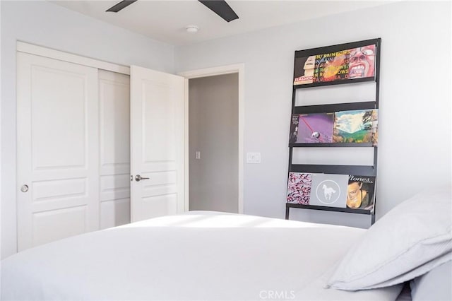 bedroom featuring ceiling fan and a closet