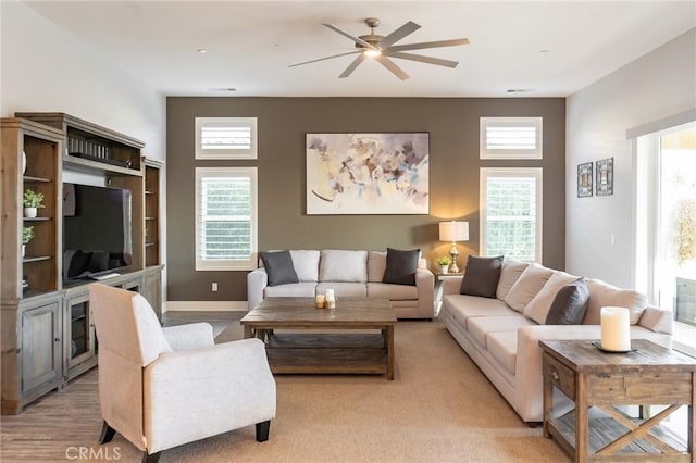 living room featuring ceiling fan