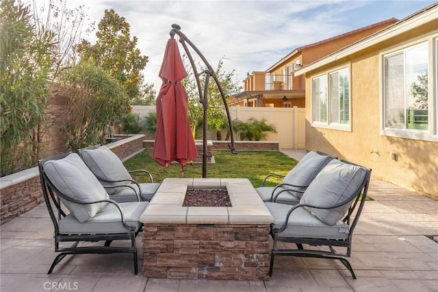 view of patio / terrace featuring an outdoor fire pit