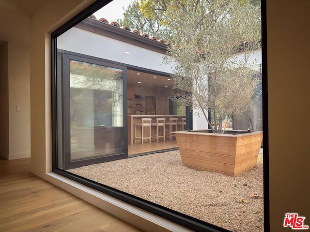 doorway to outside with hardwood / wood-style flooring