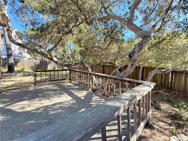 deck with a fenced backyard