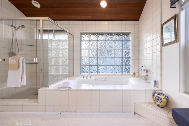 full bathroom with tile walls, wooden ceiling, a garden tub, and a shower stall