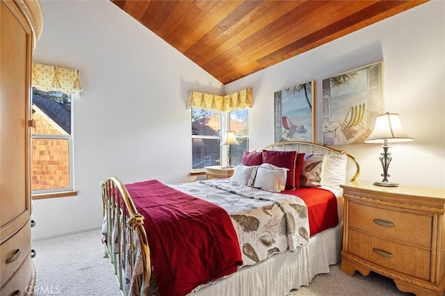 bedroom featuring lofted ceiling, wood ceiling, and light carpet