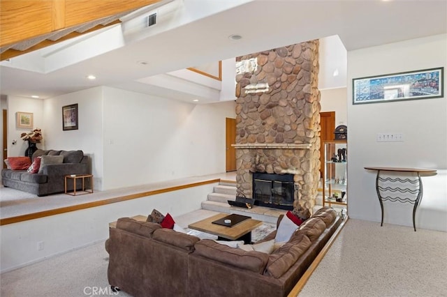 living room with recessed lighting and a fireplace