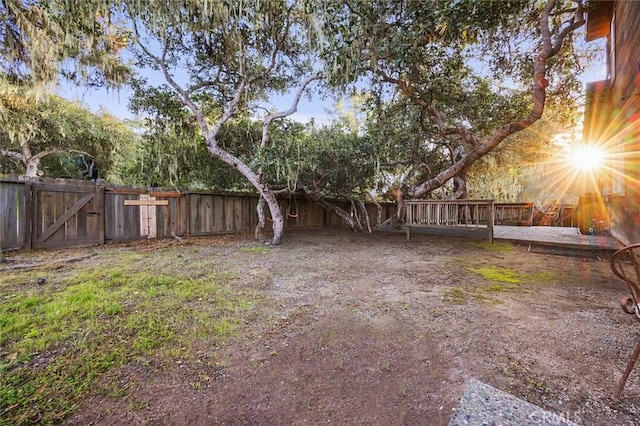 view of yard with a gate and a fenced backyard