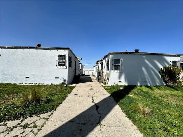 view of home's exterior featuring a lawn