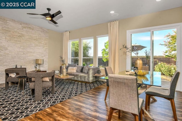 dining space featuring ceiling fan, hardwood / wood-style floors, and a wealth of natural light