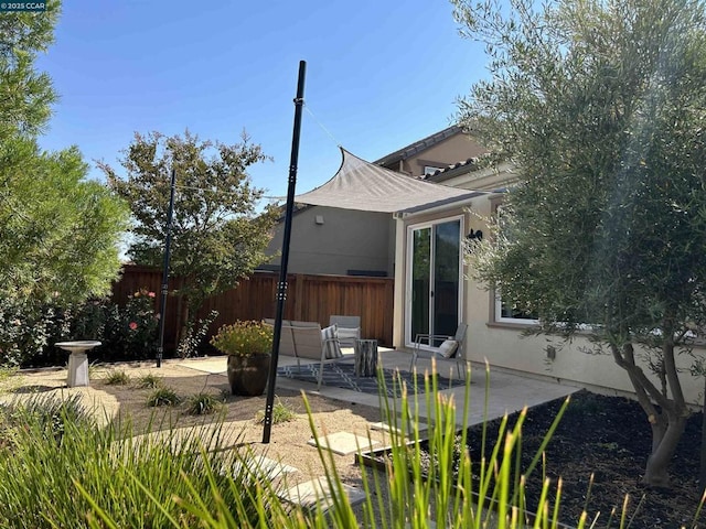 rear view of house featuring a patio area