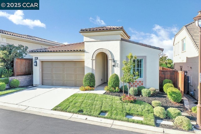 mediterranean / spanish-style home featuring a garage