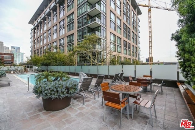 view of patio / terrace with a community pool