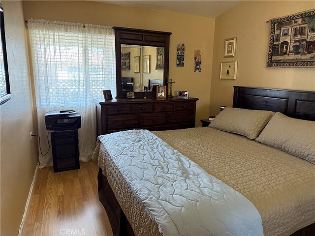 bedroom with light hardwood / wood-style flooring