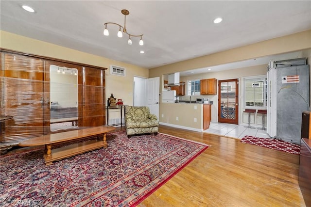 living room with light hardwood / wood-style floors