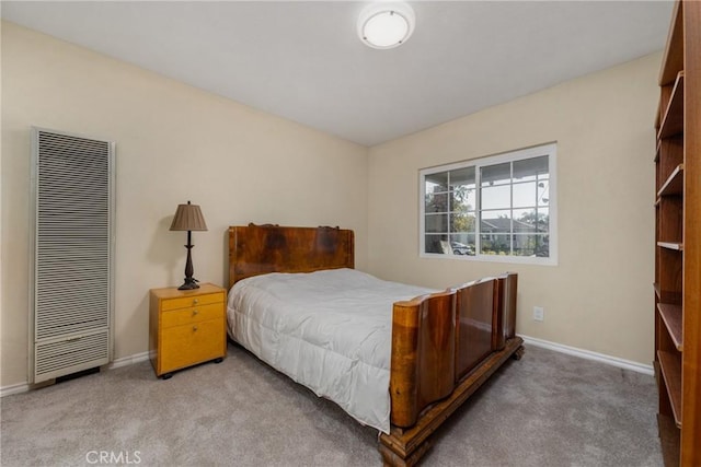 bedroom with light colored carpet