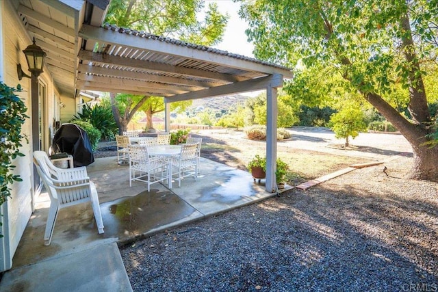 view of patio / terrace featuring grilling area and a pergola