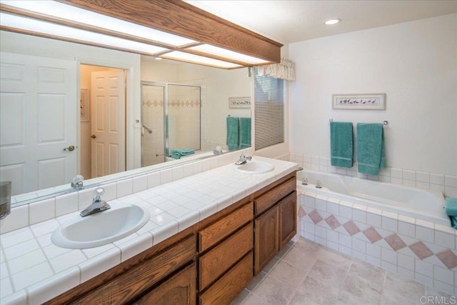 bathroom featuring tile patterned floors, vanity, and independent shower and bath