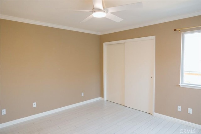 unfurnished bedroom featuring light hardwood / wood-style flooring, ornamental molding, a closet, and ceiling fan