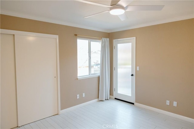 unfurnished bedroom with crown molding, ceiling fan, and light hardwood / wood-style flooring