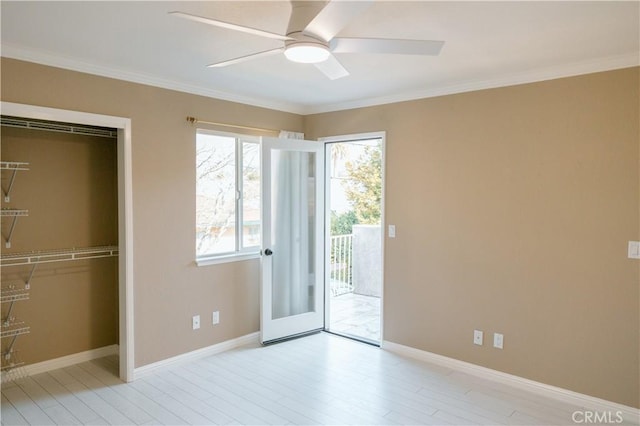 unfurnished bedroom with crown molding, ceiling fan, a closet, and access to outside