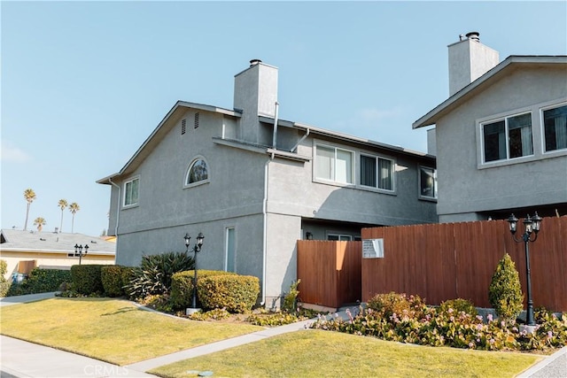 view of property exterior with a lawn