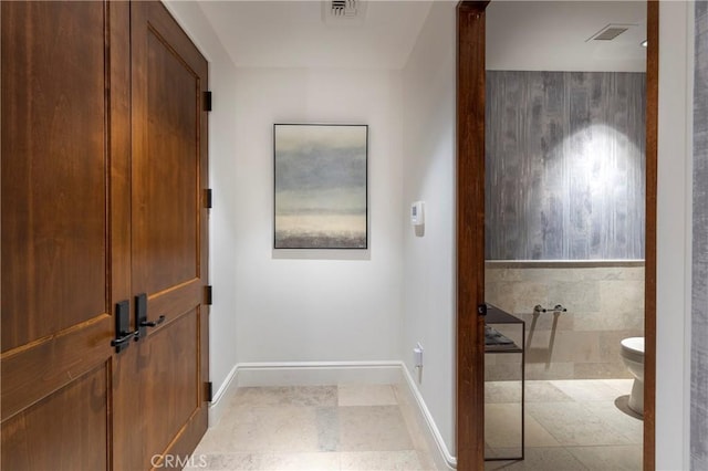 bathroom featuring tile patterned floors and toilet