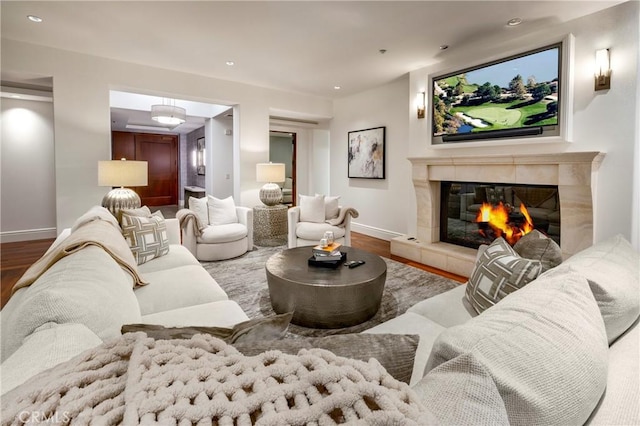 living room featuring hardwood / wood-style floors and a fireplace