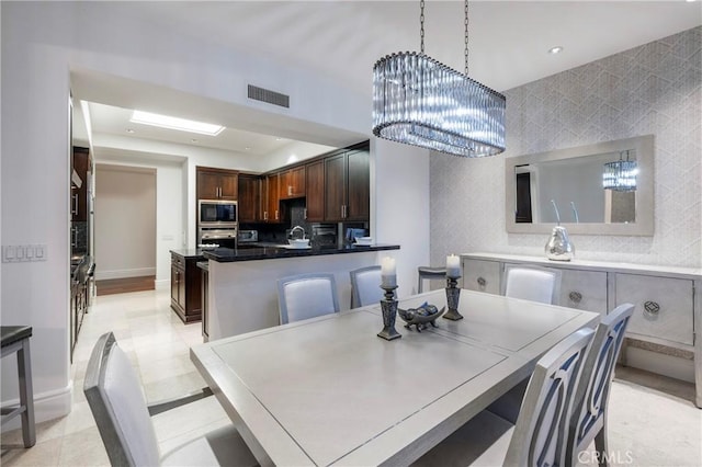 dining room featuring a notable chandelier